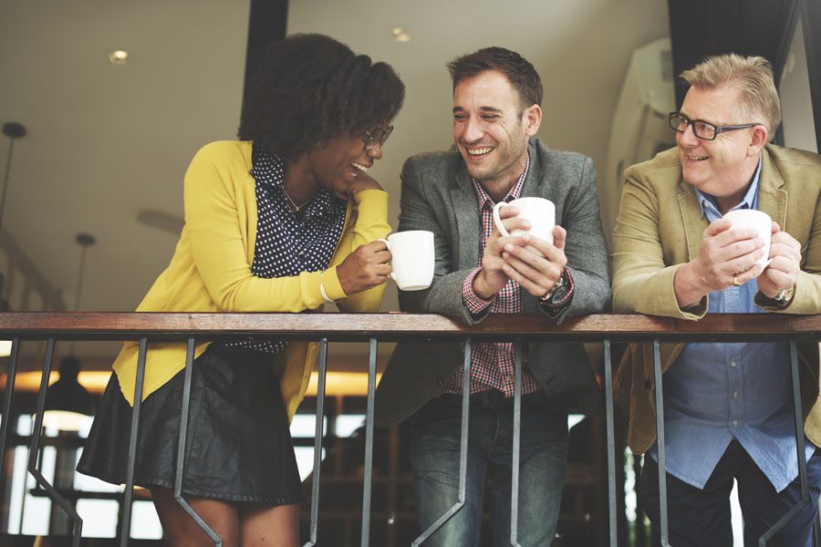 Ancillary Insurance, Group Voluntary Benefits - Co Workers Hanging Out Drinking Coffee Together